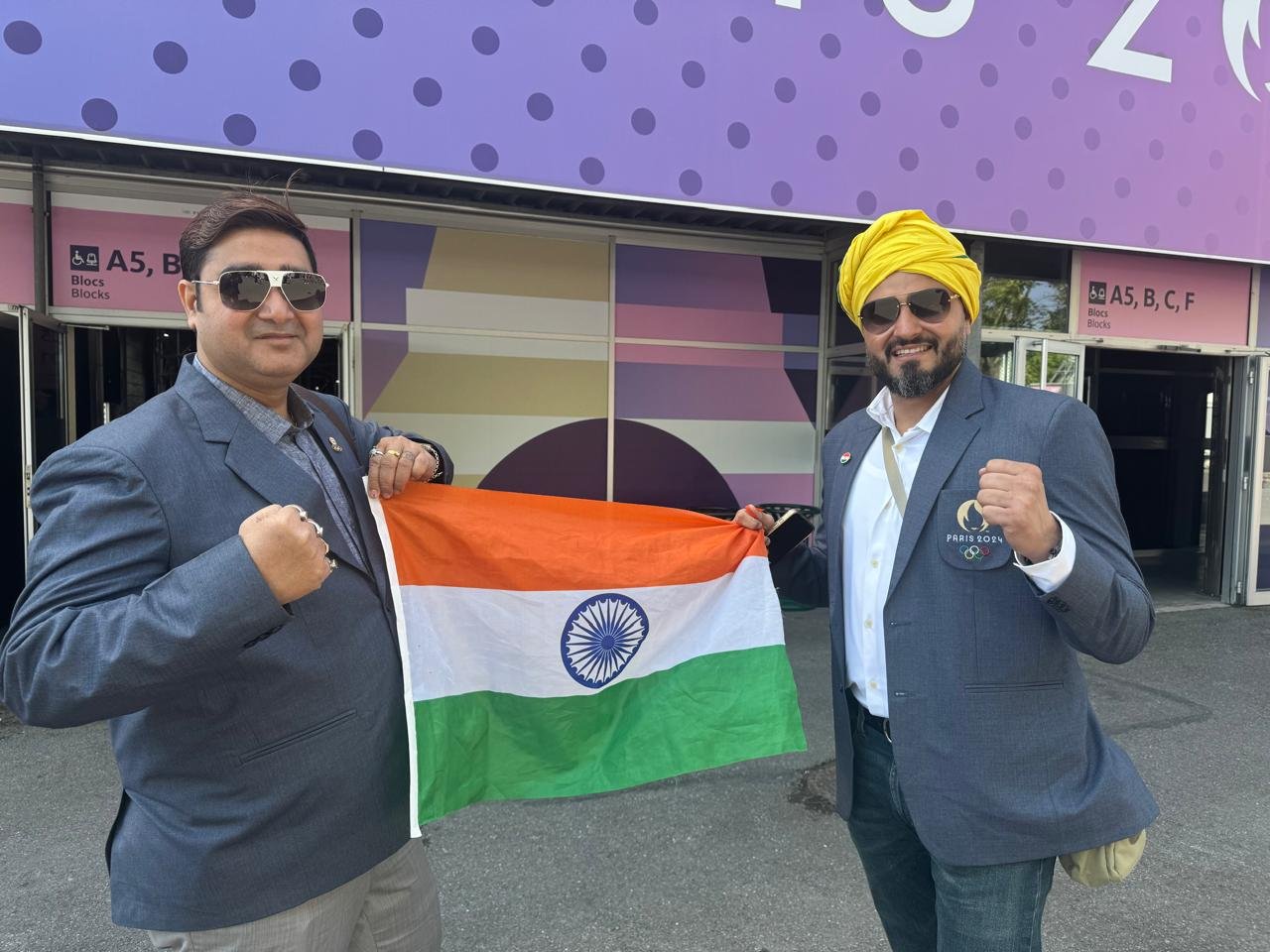 With a fellow Indian delegate at the Paris 2024 Olympic venue, flying the tricolour.